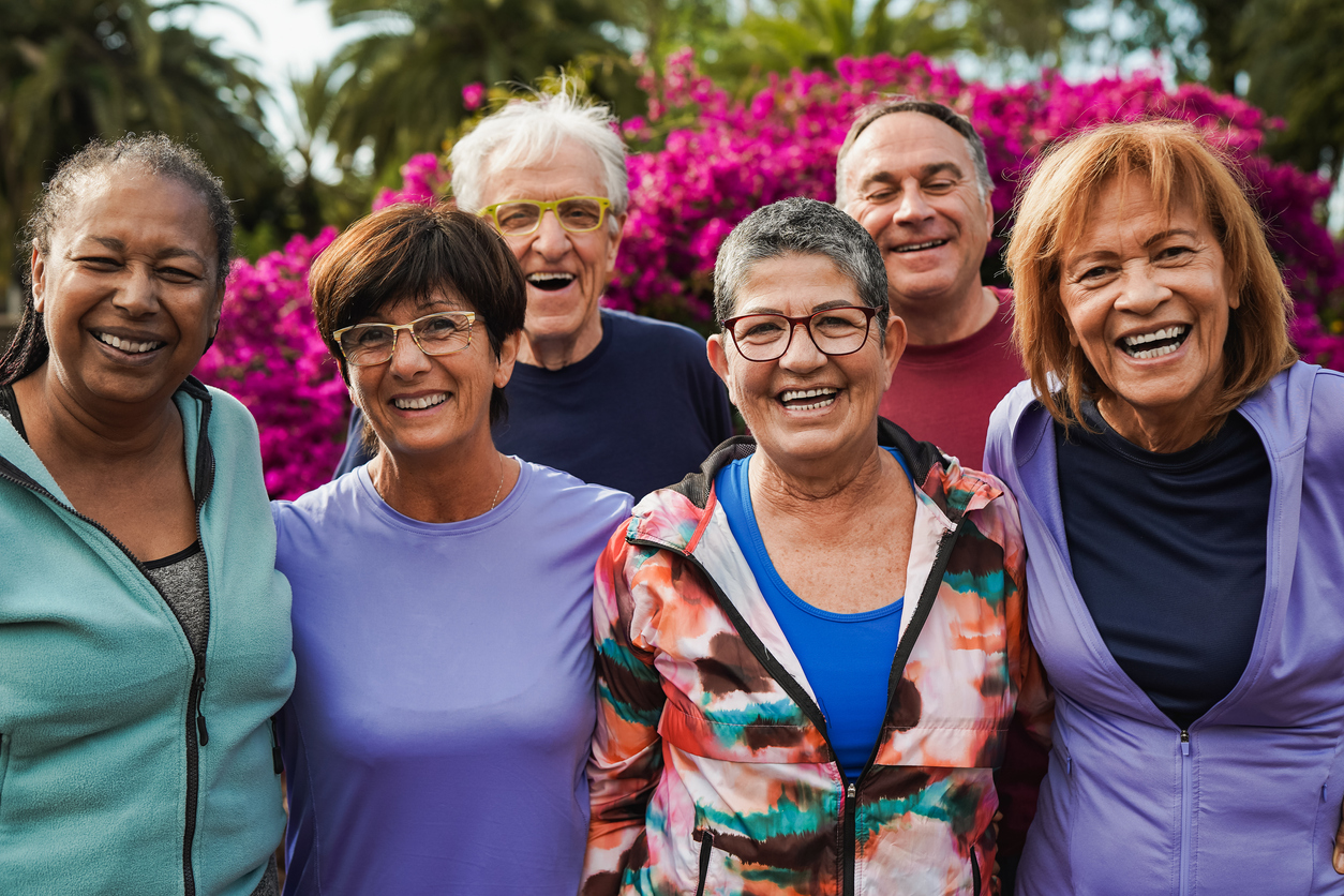 Group of senior friends smiling on camera after yoga lesson at city park Premier Senior Living in Augusta County | AVIVA Baldwin Park